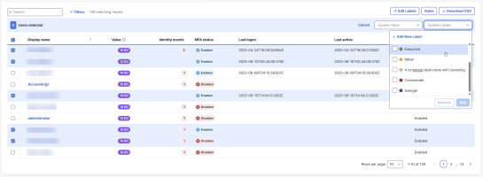 Users table with bulk action bar, showing 'Update Labels' drop-down to add or remove labels.